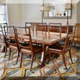 F09. Keno Brothers dining table with 2 leaves and 12 chairs. 9'2” x 4' chairs 42”h 